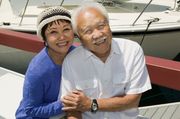 Senior couple embracing in marina