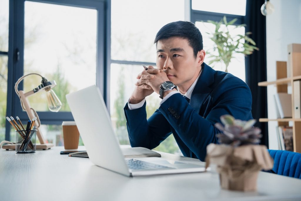 business owner pondering about his retirement plan