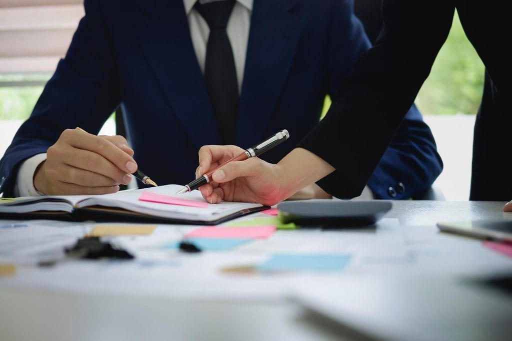 Fund managers team consultation and discuss about analysis Investment stock market by paperwork..